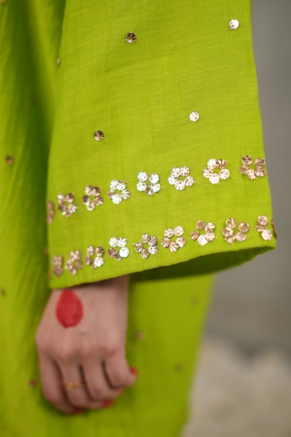 Firdaus Parrot Green Farshi suit — cuff detail