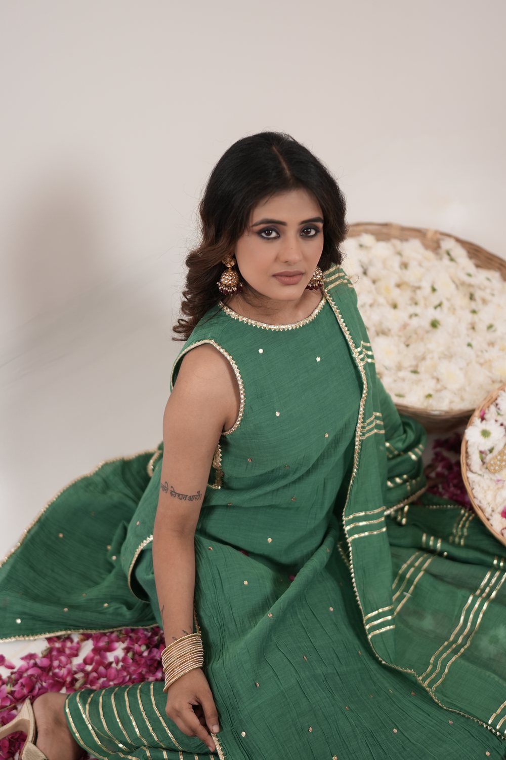 Resham Royal Green suit set — seated portrait